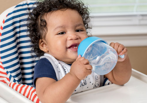 Start by replacing one bottle with the cup at mealtime.
