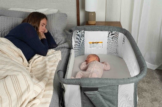 A new mom rests as her baby sleeps